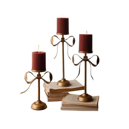 Set of Three Antique Brass Pillar Candle Bow Detail Stands